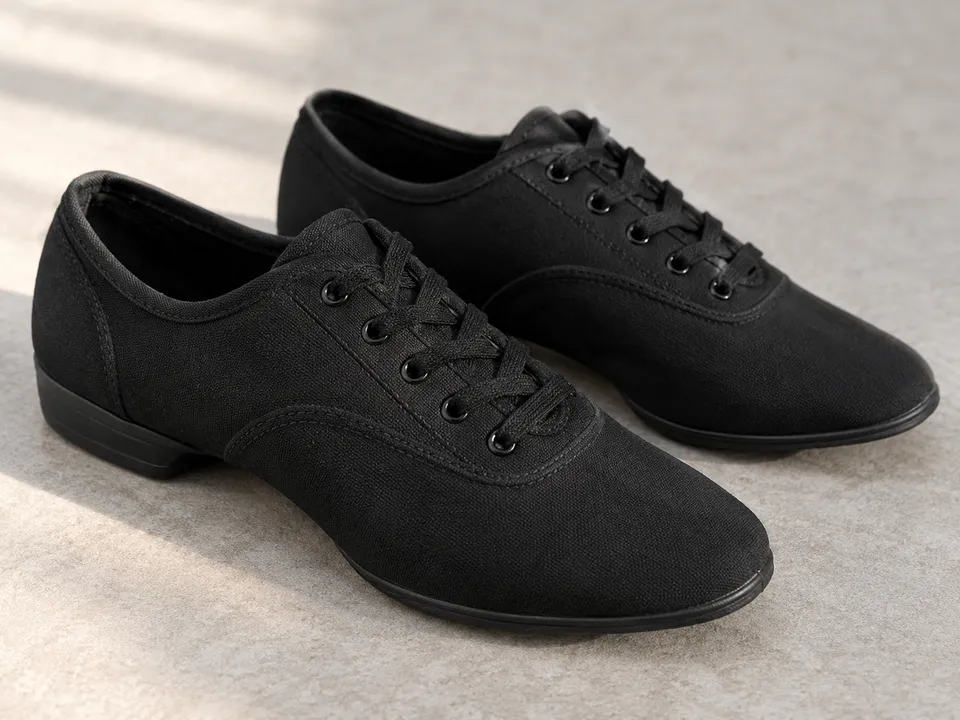 AI-generated illustration: A pair of plain black dance-training shoes.