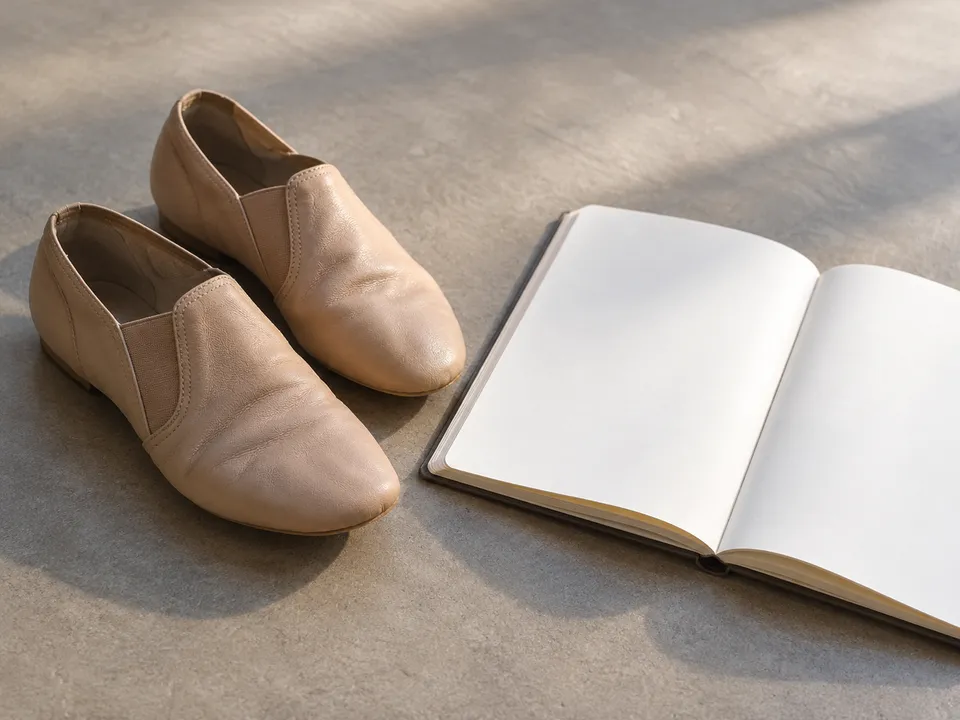 AI-generated illustration: jazz dance shoes and a blank rehearsal notebook.