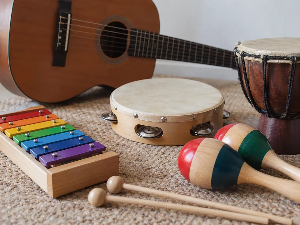 AI-generated illustration: unbranded instruments for beginner music and rhythm exploration.