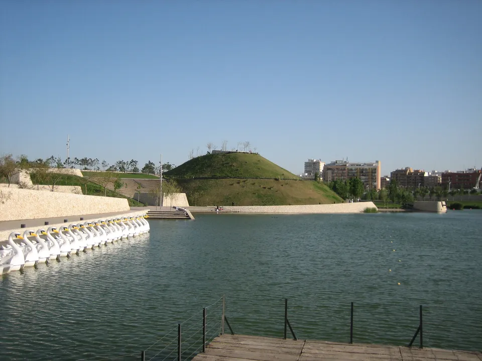 Lake and landscaped hill in Parque de Cabecera, Valencia.
