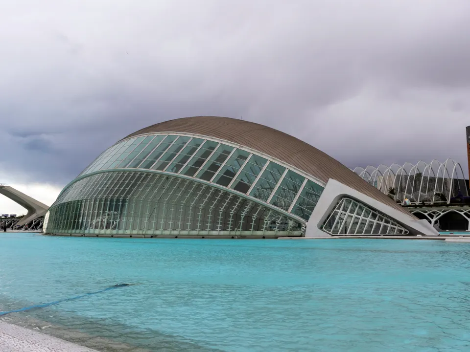 Hemisfèric building beside its reflecting pool in Valencia.